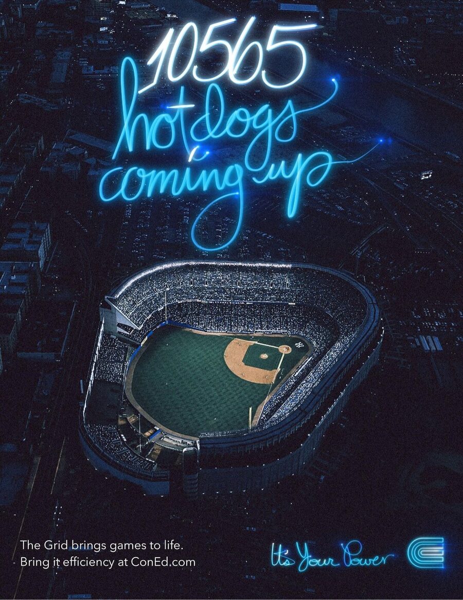 poster: 10565 hotdogs coming up, in neon over a lit stadium